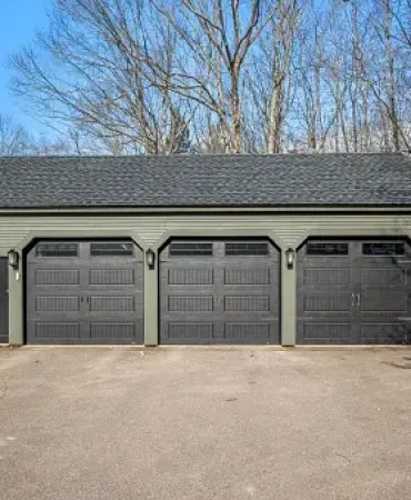 A forest house with automatic garages and lantern captured in a snow-covered forest in winter